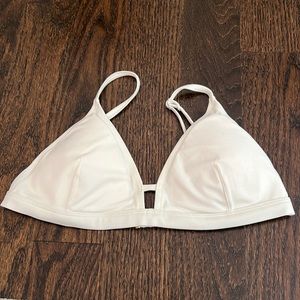 Lively white swim top with gold detail